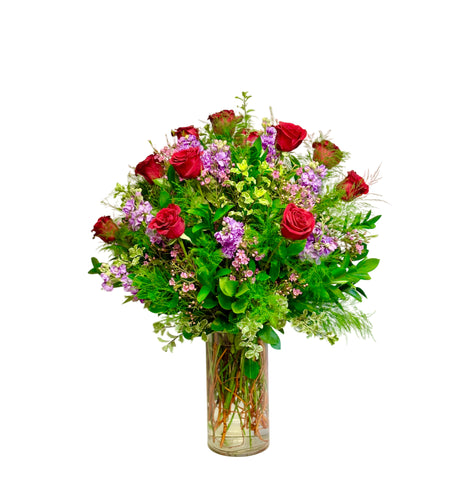 12 Red Primavera Red Roses with Stock, Waxflower and Ruscus